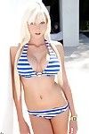 Doll-face teenage blonde with big tits Rikki Six slipping off her bikini