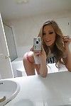 Young blonde Samantha Saint taking nude selfies in the bathroom