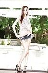 Anorexic young girl Jenna Justine siding short denim shorts over long legs