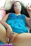 Naughty teen smoker rubs her pussy while she smokes a cigarette
