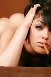 Gorgeous babe Sadie West is smoking posing naked on high heels