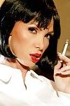 Elegant babe Nikki Benz is smoking and gets undressed to show her body