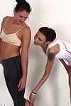 Horny lesbian gymnasts stretching and fucking
