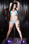 Inked brunette MILF stripper Jordyn Shane shedding bikini on stripper pole