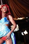 Redhead ebony pornstar Jasmine Webb performing a hot striptease
