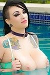 Busty tattooed babe scarlet lavey naked in the pool
