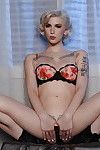Tattooed alt babe Indigo Augustine poses fully clothed and in lingerie