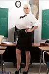 Mature teacher Kayla Kleevage denudes her giant tits in the classroom