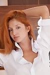 Red fox in white shirt and orange panties fingering her pussy
