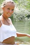 Teen girl gets wet in river as guys paddle by