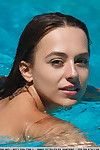 Beautiful teen Dominika A in swimsuit shows her wet pussy by the pool