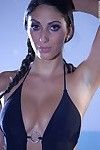Busty Latina pornstar lets her big juggs loose from wet bathing suit