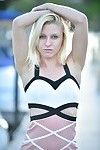 Athletic blonde babe strips down outside and stretches her tight pussy