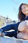 Flexible fitness girl in yoga pants spreading ass & fisting pussy outdoors