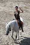 Pornstar Aletta Ocean is riding a horse outdoor in glasses