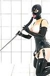 BDSM enthusiast Latex Lucy toying MILF pussy in fetish clothing and hood