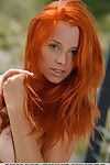 Alluring redhead Ariel Piper Fawn freeing nice MILF tits during glam spread