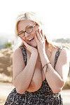 Chubby blonde teen Kylee Wilson exposing her big natural tits outdoors