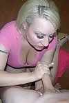 Big tittied blonde chick gives a handjob