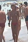 Nice mix of nude candid pictures taken on the beach