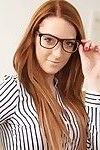 Hot busty redhead with sexy glasses