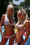 Young babes with big tits Kenzi and Britney posing outdoor in the pool