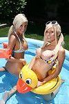 Young babes with big tits Kenzi and Britney posing outdoor in the pool