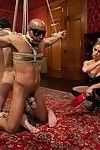 Hot dominatrix uses two slaves in chastity for her pleasure