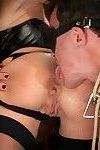 Hot dominatrix uses two slaves in chastity for her pleasure