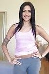 Smiley latina in yoga pants revealing her goods on camera