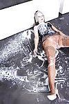 Fully clothed redhead in heels gets covered in cum in gloryhole bukkake