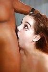 Naked young girl has gigantic black cock shoved all the way down throat