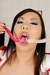 Asian MILF in latex outfit Tigerr Benson playing with condoms full of jizz