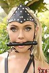 Blonde babe Chloe Toy is restrained outdoors with pony bit gag in mouth