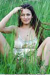 European glamour model Sofi A revealing perfect breasts in country field