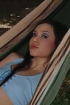 Gorgeous Asian amateur Angelica undressing outdoors in back yard hammock