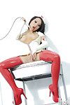 Asian nurse in latex stockings performs a hot both holes masturbation scene