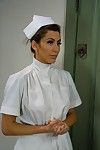 Brunette is strapon fucked by nurse in medical play scene