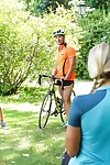 Blond cyclist Christen Courtney bangs 2 fellow riders on campsite picnic table