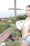 Ebony amateur Calypsa frees tiny tits from bikini before masturbating on patio