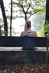 Mature amateur shows her big boobs and butt on bench in the forest