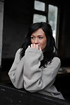 Dark haired chick Tess Lyndon hikes her sweater to show her firm tits and cunt