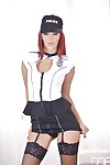 Redheaded solo girl Aylin Diamond struts in police uniform and stockings