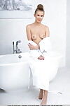 Teen model Casey slips off her bathrobe before a nude solo shoot in a bathtub