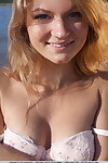White teen Patritcy A slips off lace lingerie to pose naked at the beach