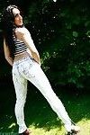 Hot brunette chloe poses in her tight jeans outside