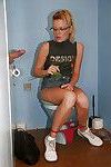 Geeky babe in glasses pisses in toilette room and swallows prick