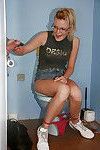 Geeky babe in glasses pisses in toilette room and swallows prick