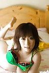 Full-bosomed asian coed Hanano Nono stripping off her underwear on the bed