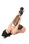 Hot busty brunette babe spreading in black stockings